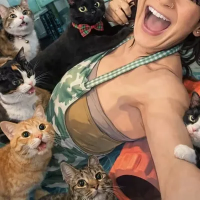 Miss Meow, founder of Purr Vida Lounge, with a rescue cat